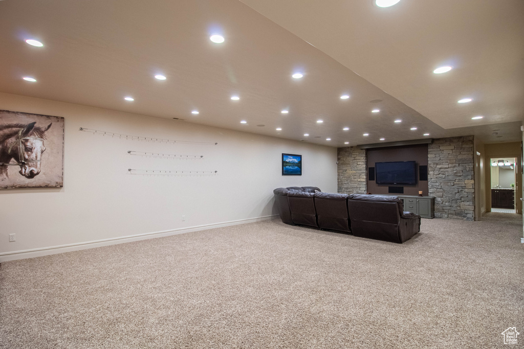 Living room with light carpet and recessed lighting