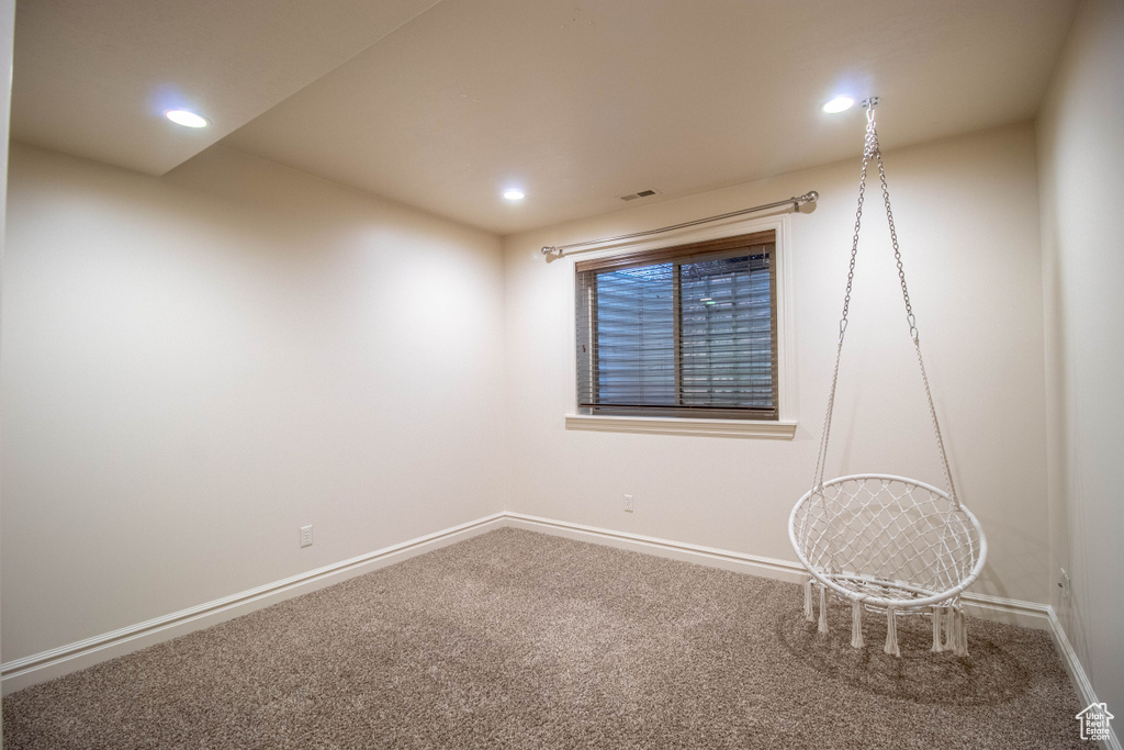Empty room featuring carpet and recessed lighting