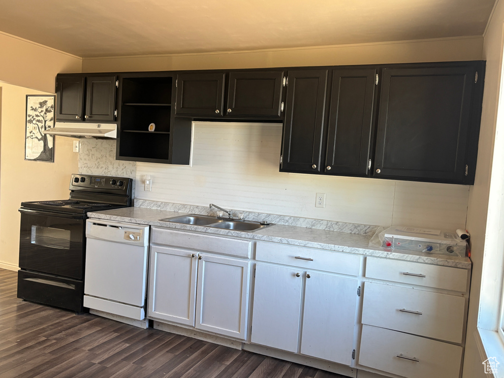Kitchen featuring electric range, dishwasher, dark wood finished floors, and light countertops