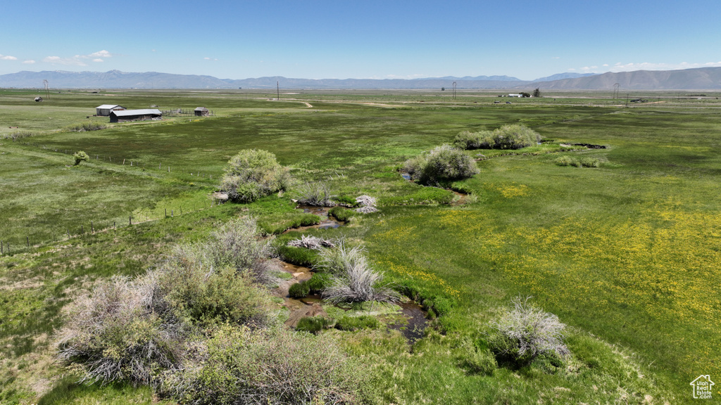 Aerial overview of property's location featuring rural landscape and mountains
