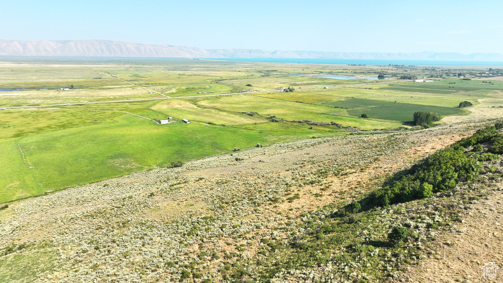 Aerial view of sparsely populated area with a mountain backdrop