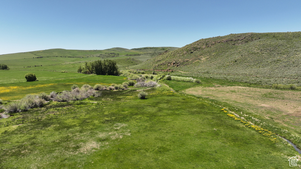 View of mountain backdrop featuring rural landscape
