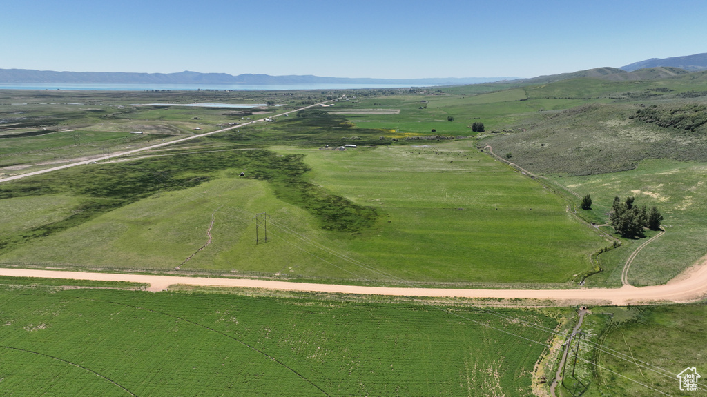 Aerial overview of property's location with rural landscape and mountains