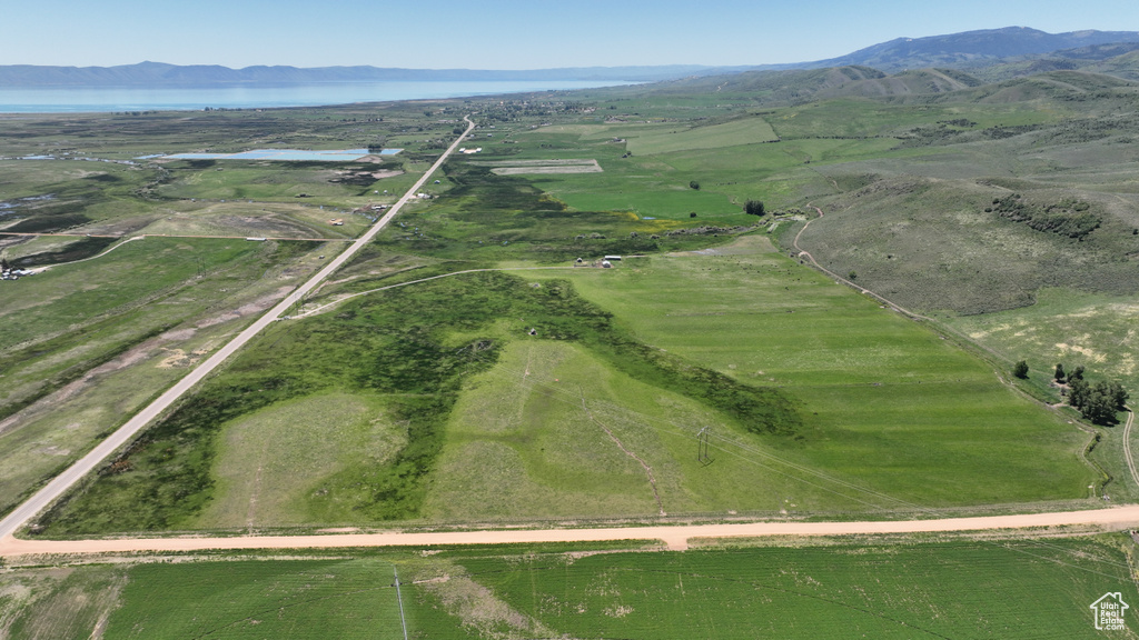 Aerial view of property's location with rural landscape and a water and mountain view