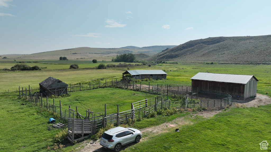 View of mountain background featuring rural landscape