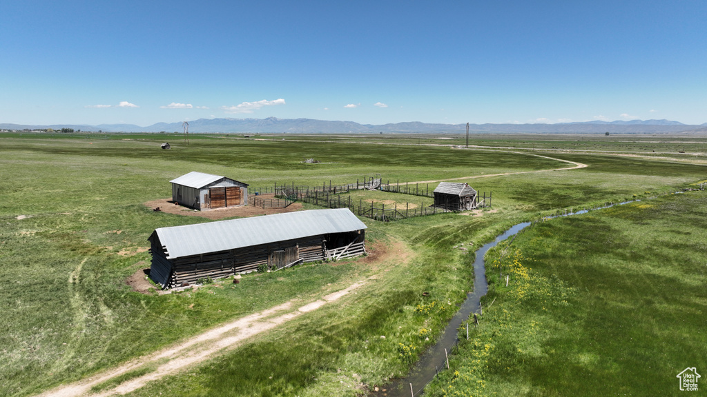 View of rural area featuring a mountainous background and a pastoral area