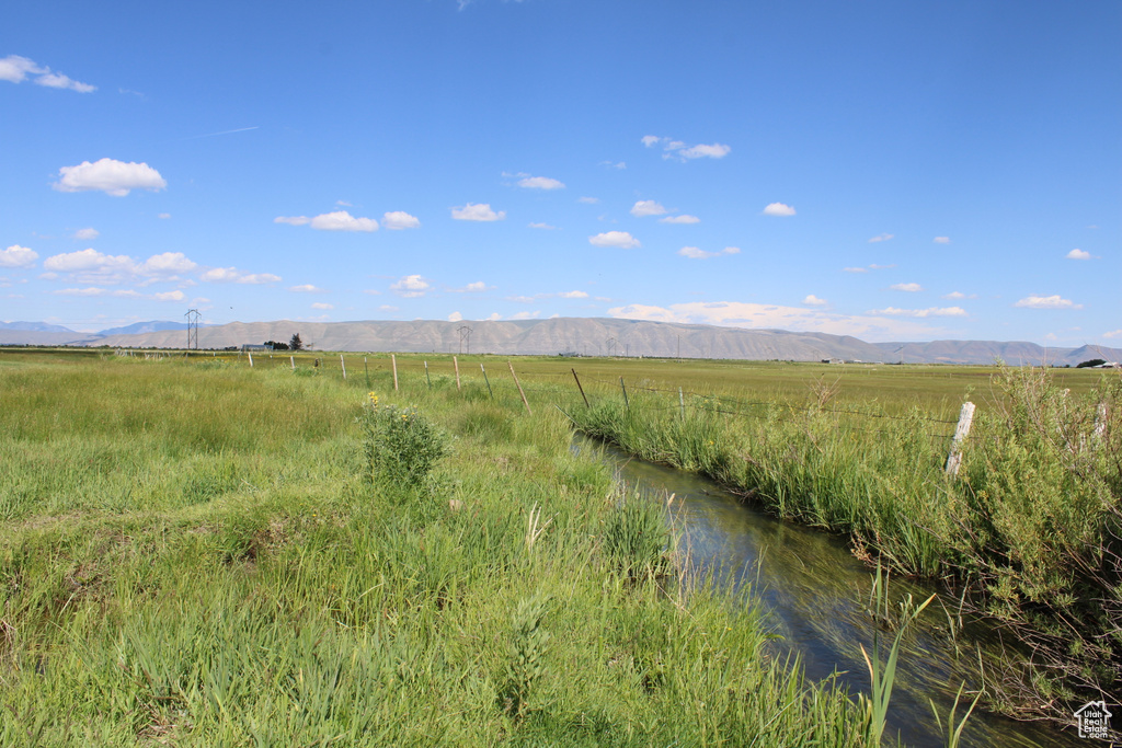 View of mountain backdrop featuring rural landscape