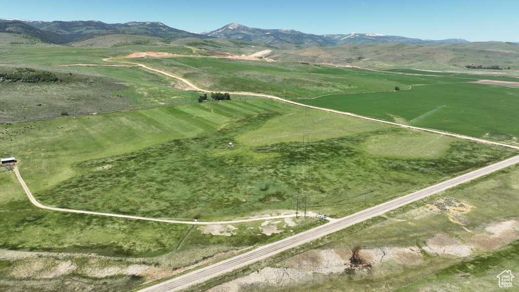 View of mountain backdrop featuring rural landscape