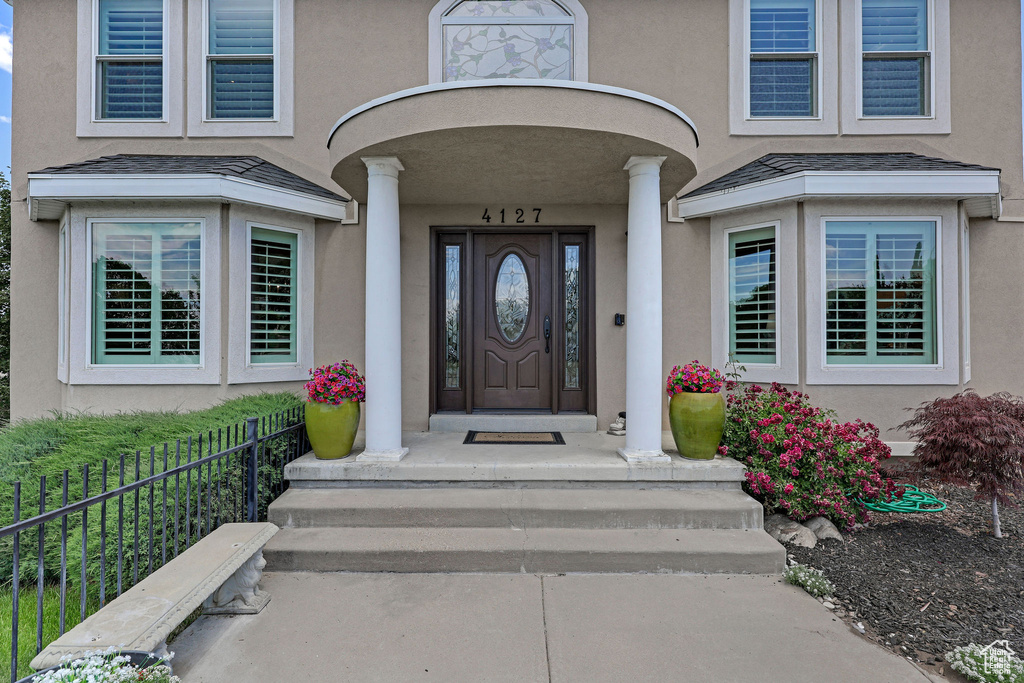 Property entrance with stucco siding