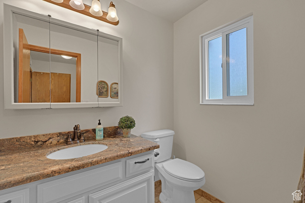 Bathroom with vanity and tile patterned floors