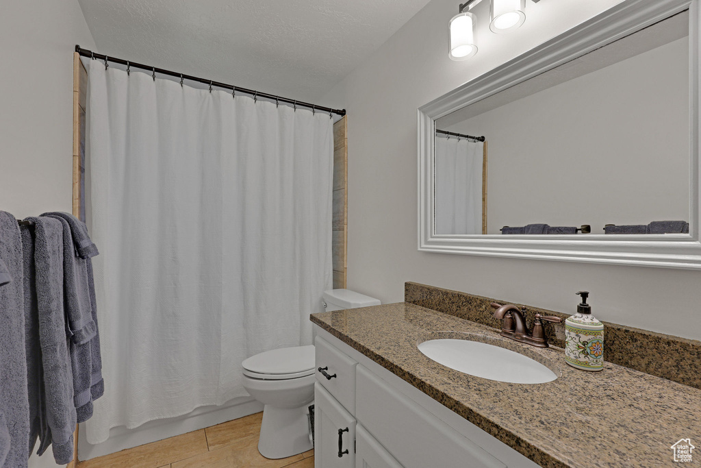 Full bath with vanity and toilet
