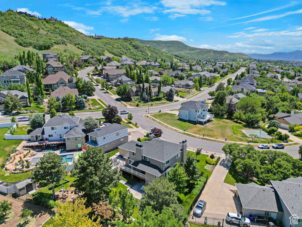 Aerial perspective of suburban area featuring a mountainous background