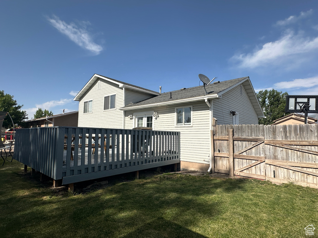 Rear view of property with a wooden deck