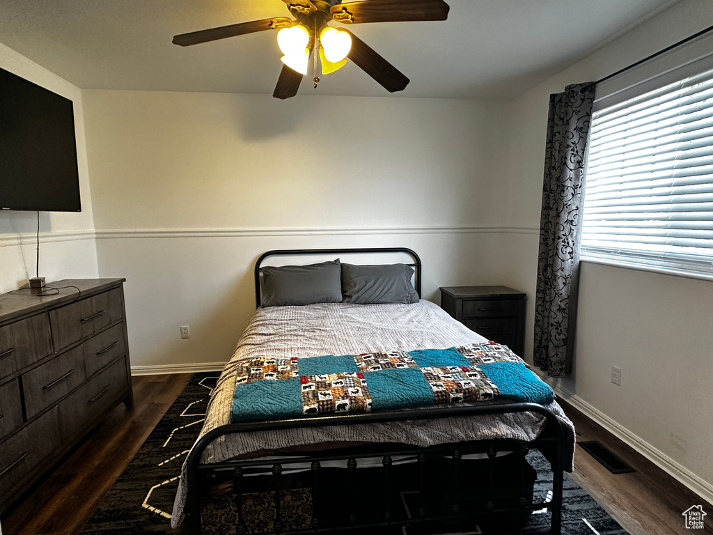 Bedroom featuring wood finished floors and a ceiling fan
