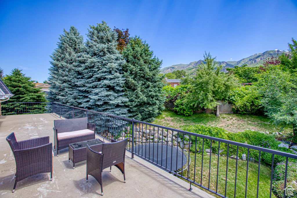 View of patio featuring a mountain view and an outdoor living space