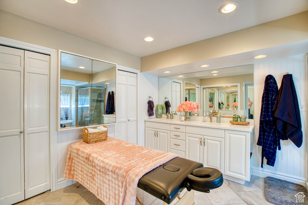 Full bathroom with vanity, recessed lighting, a shower stall, and tile patterned flooring