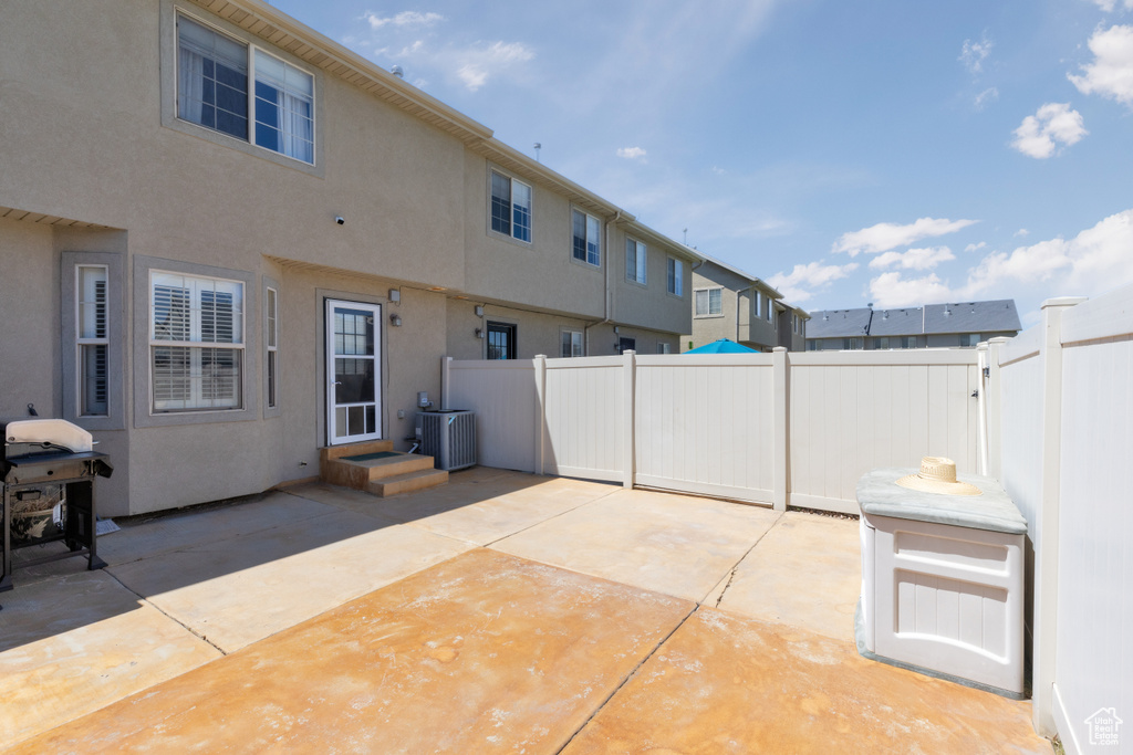 Fenced backyard featuring a patio and area for grilling