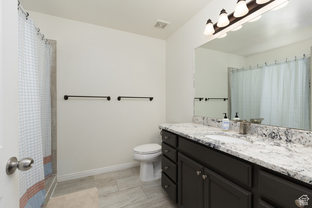 Bathroom featuring vanity and a shower with curtain