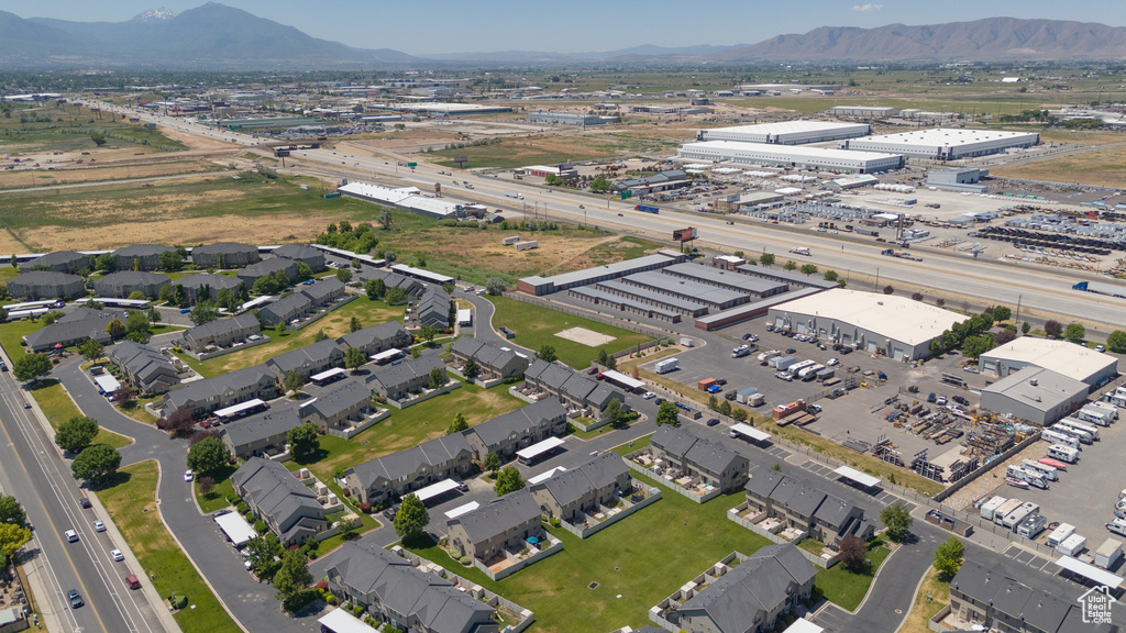 Aerial view of property's location with a mountain backdrop