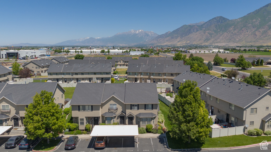Aerial perspective of suburban area with a mountain backdrop