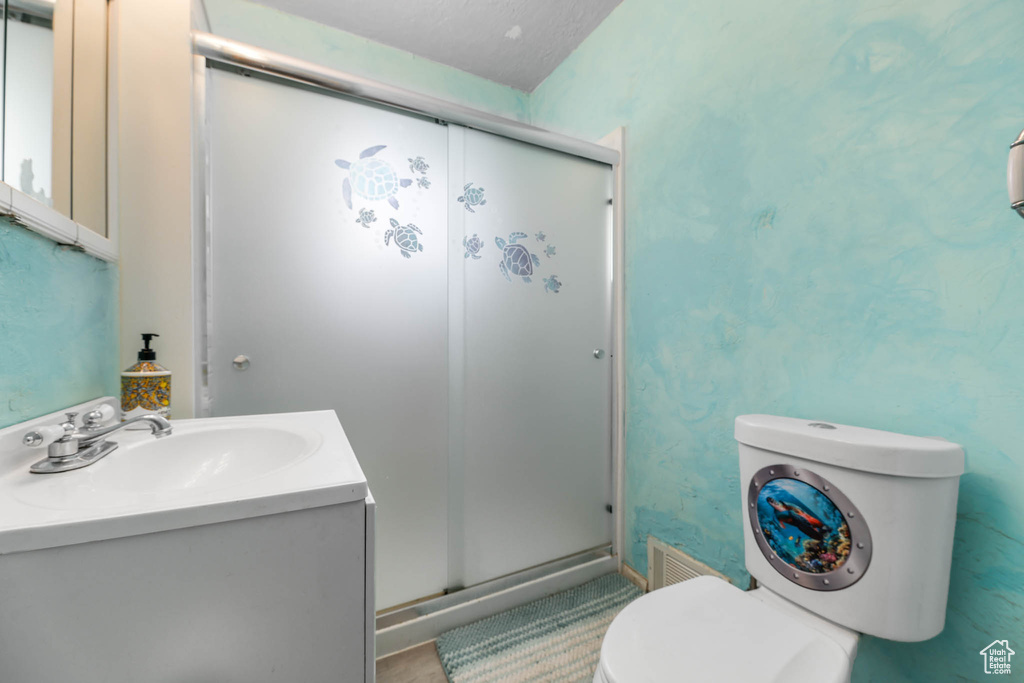 Full bath featuring vanity and a shower stall