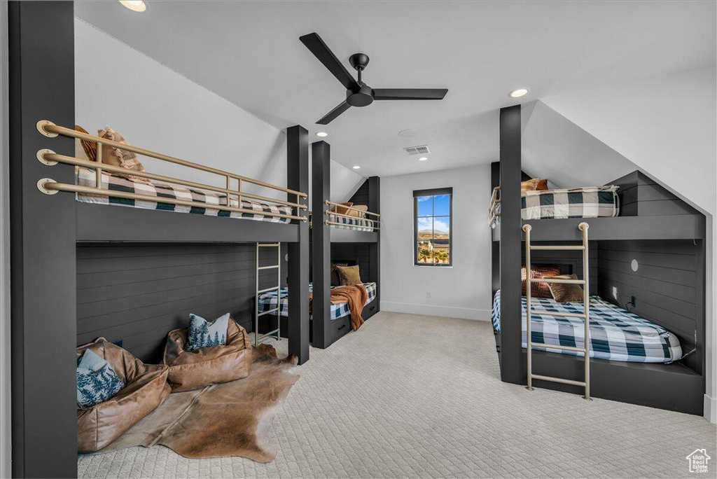 Bedroom featuring vaulted ceiling, carpet, recessed lighting, and a ceiling fan