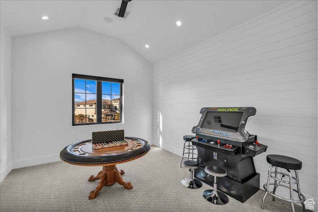 Rec room featuring carpet, recessed lighting, and vaulted ceiling