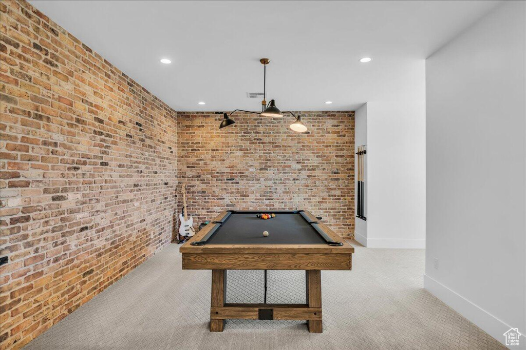 Playroom with billiards table, carpet floors, recessed lighting, and brick wall