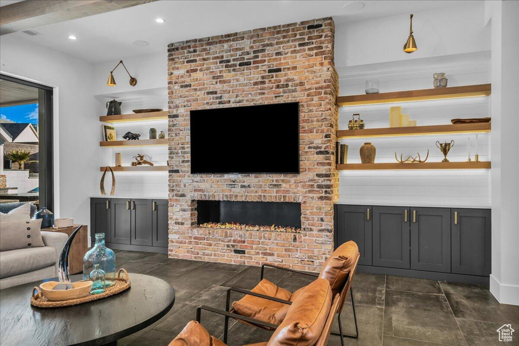 Living room with a fireplace and recessed lighting
