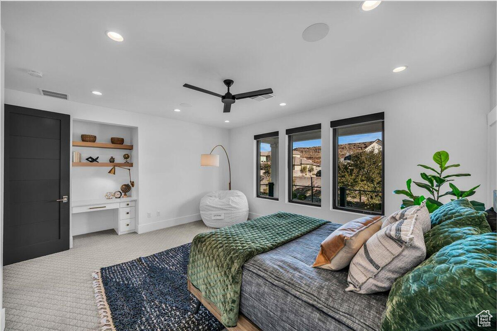 Bedroom featuring light carpet, recessed lighting, and a ceiling fan