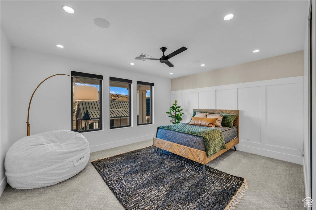 Carpeted bedroom featuring recessed lighting and ceiling fan