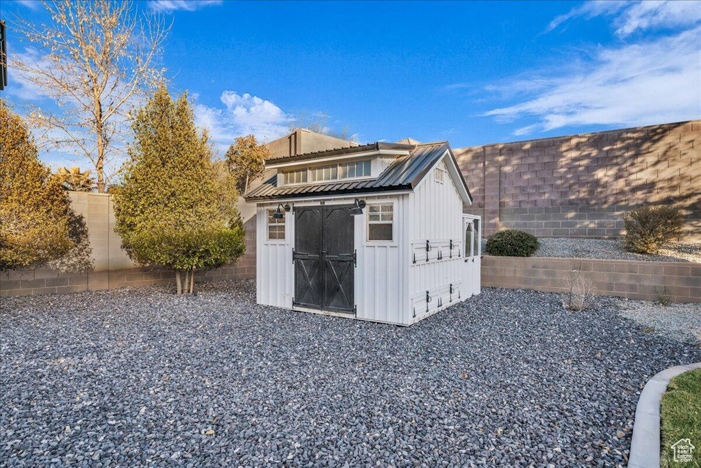 View of shed featuring a fenced backyard