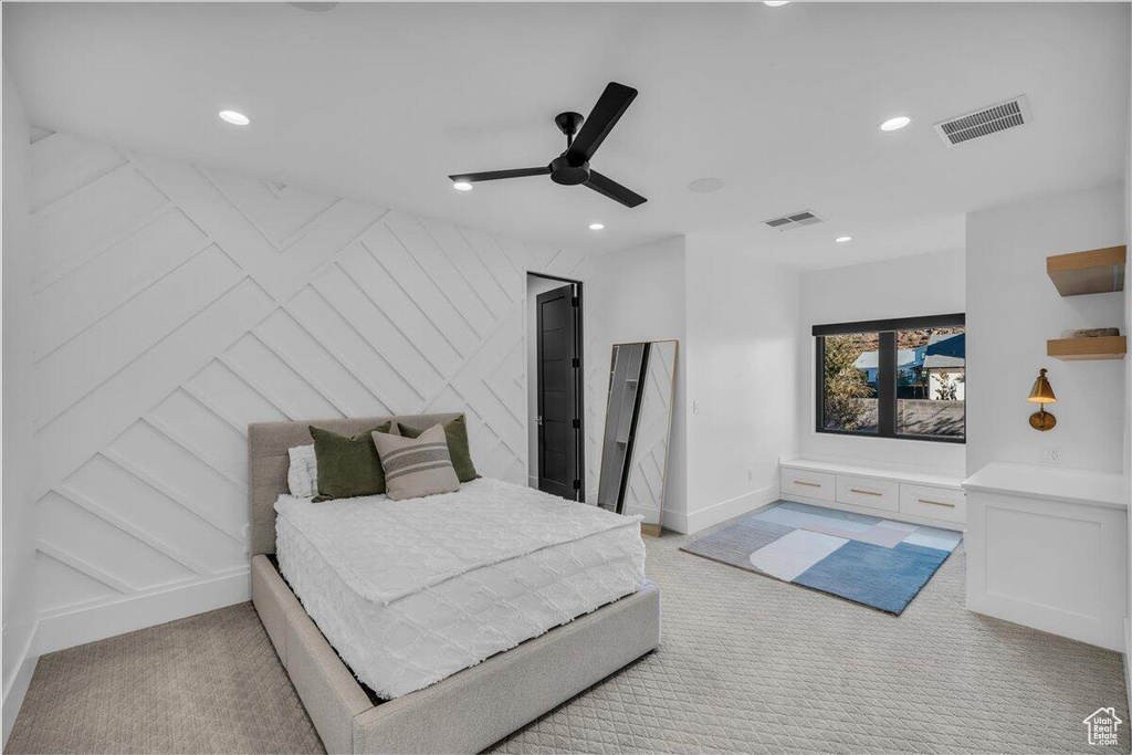 Carpeted bedroom featuring recessed lighting and ceiling fan