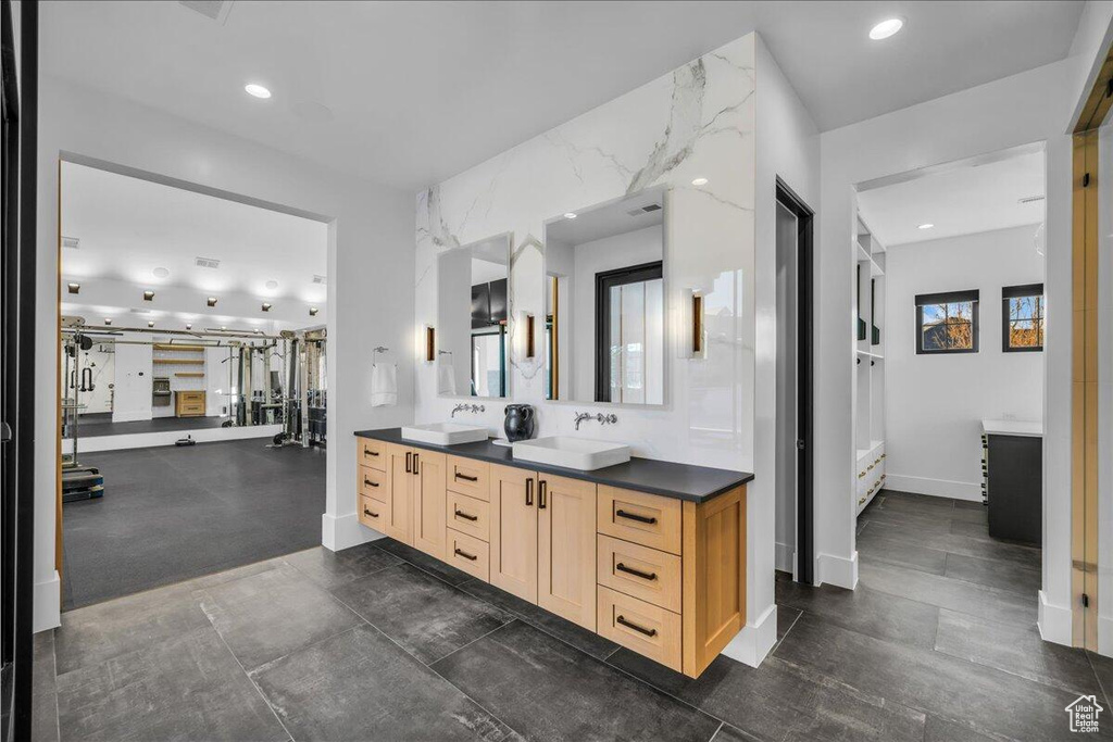 Bathroom with double vanity and recessed lighting