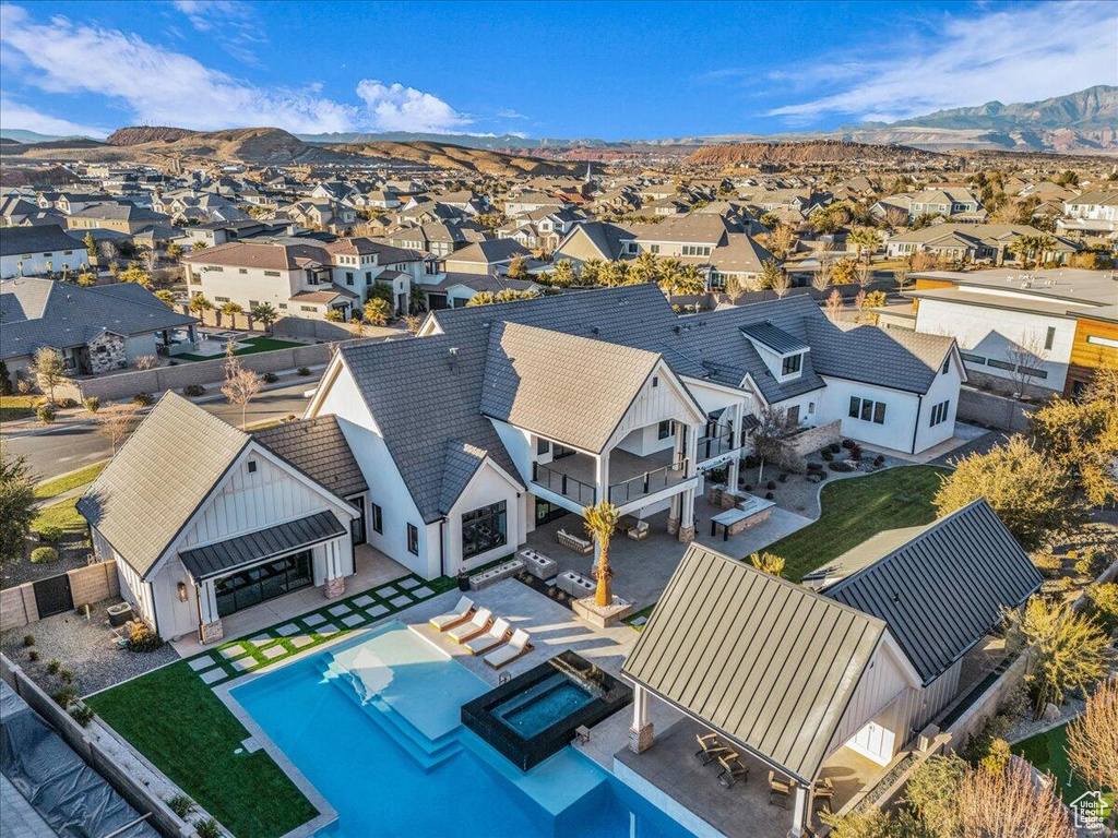 Aerial view of residential area featuring mountains