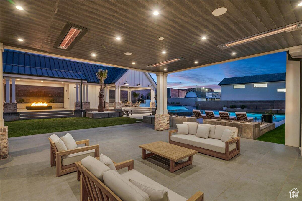 View of patio / terrace with an outdoor living space with a fireplace