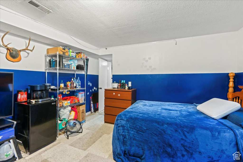 Bedroom featuring a textured ceiling
