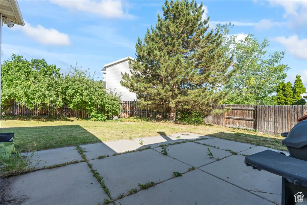 Fenced backyard with a patio area