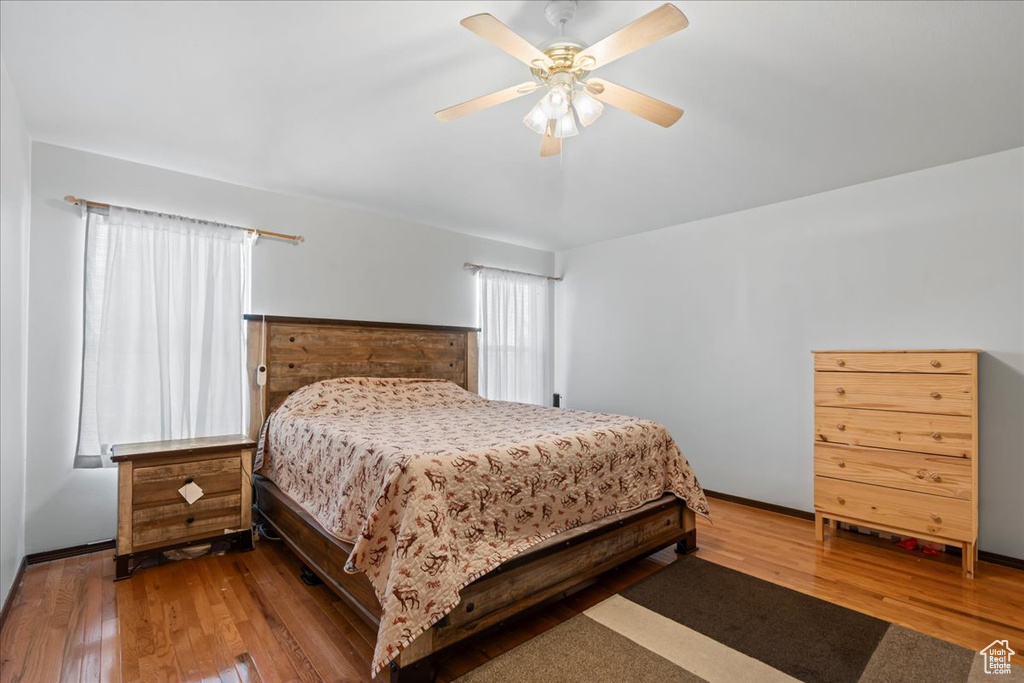 Bedroom featuring hardwood / wood-style flooring and ceiling fan