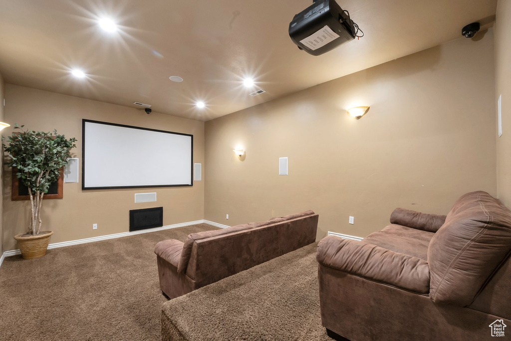 Home theater with carpet floors and recessed lighting