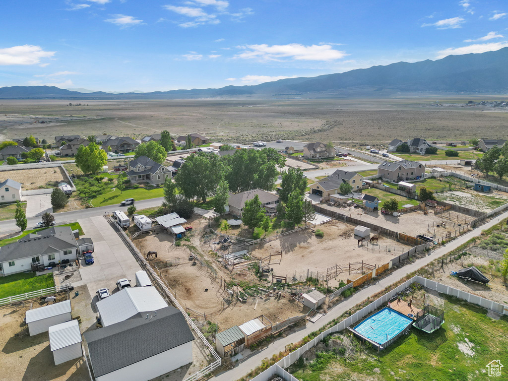 Aerial perspective of suburban area featuring a mountainous background