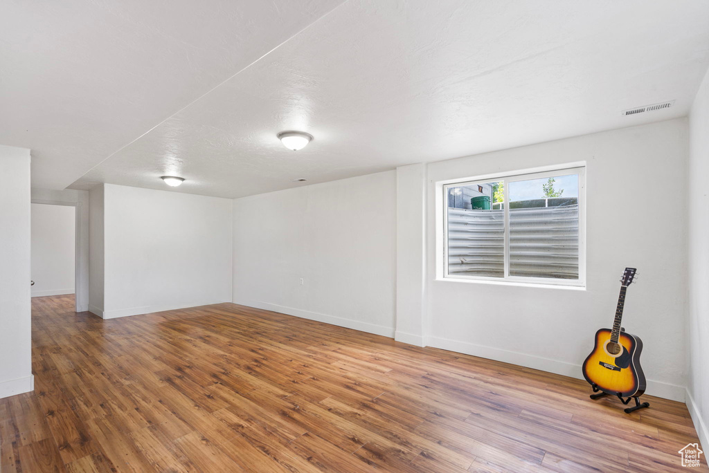 Unfurnished room featuring wood finished floors