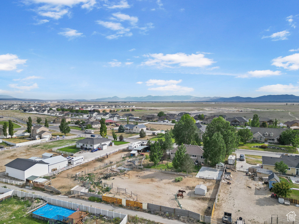 Aerial view of residential area featuring a mountain backdrop