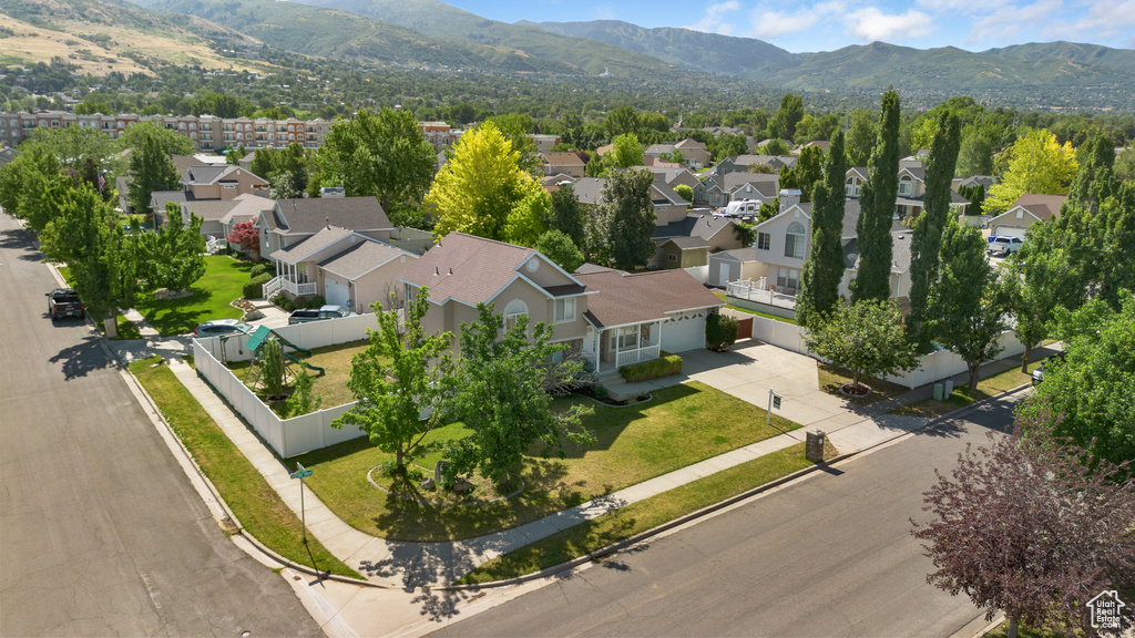 Aerial view of residential area featuring a mountain backdrop