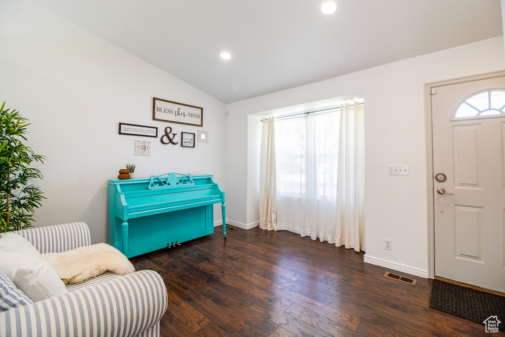 Entrance foyer with wood finished floors, vaulted ceiling, and recessed lighting