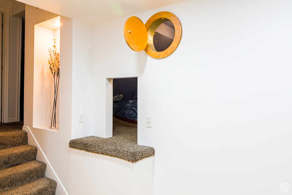 Stairs featuring carpet and baseboards