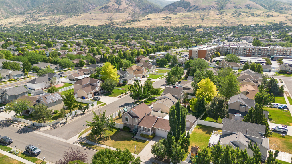 View of property location featuring mountains and nearby suburban area