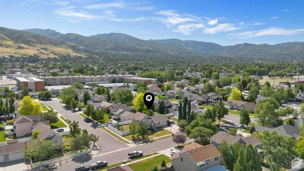 Aerial perspective of suburban area with a mountain backdrop