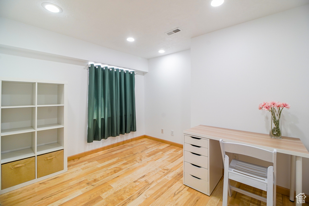 Unfurnished office featuring light wood-style flooring and recessed lighting