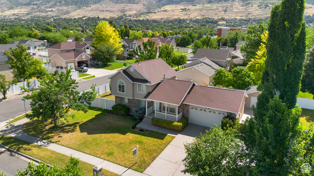 Aerial perspective of suburban area with a mountain backdrop